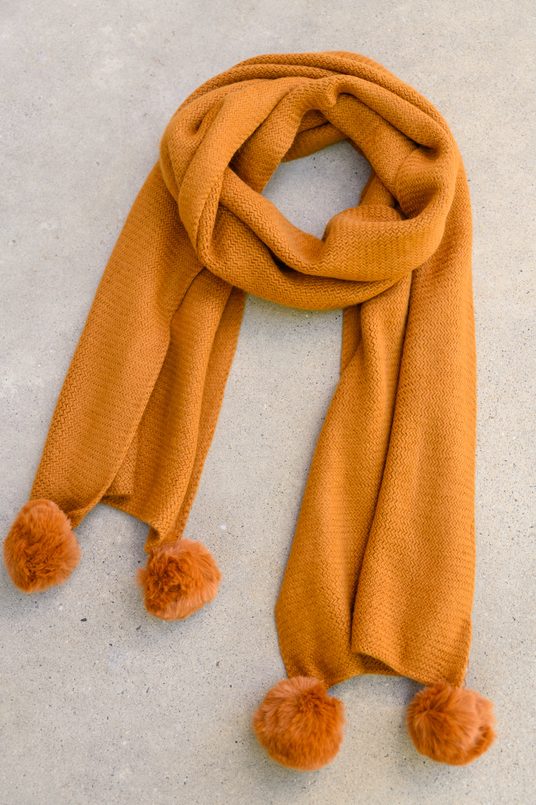 KnittedFuzzyPomPomScarfInGinger2